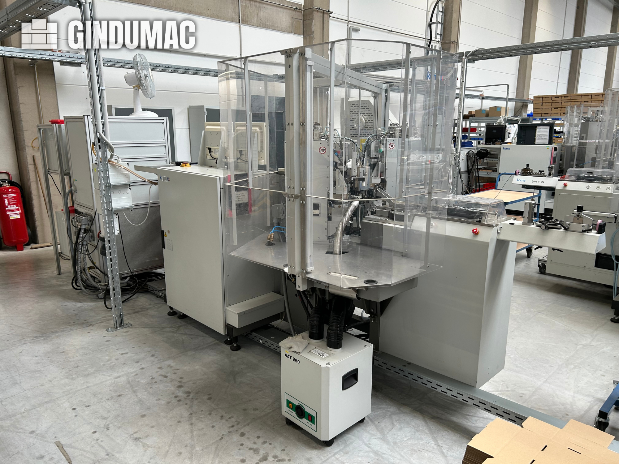 Machine de traitement et de sertissage de fils entièrement automatique KOMAX Alpha 433 L
